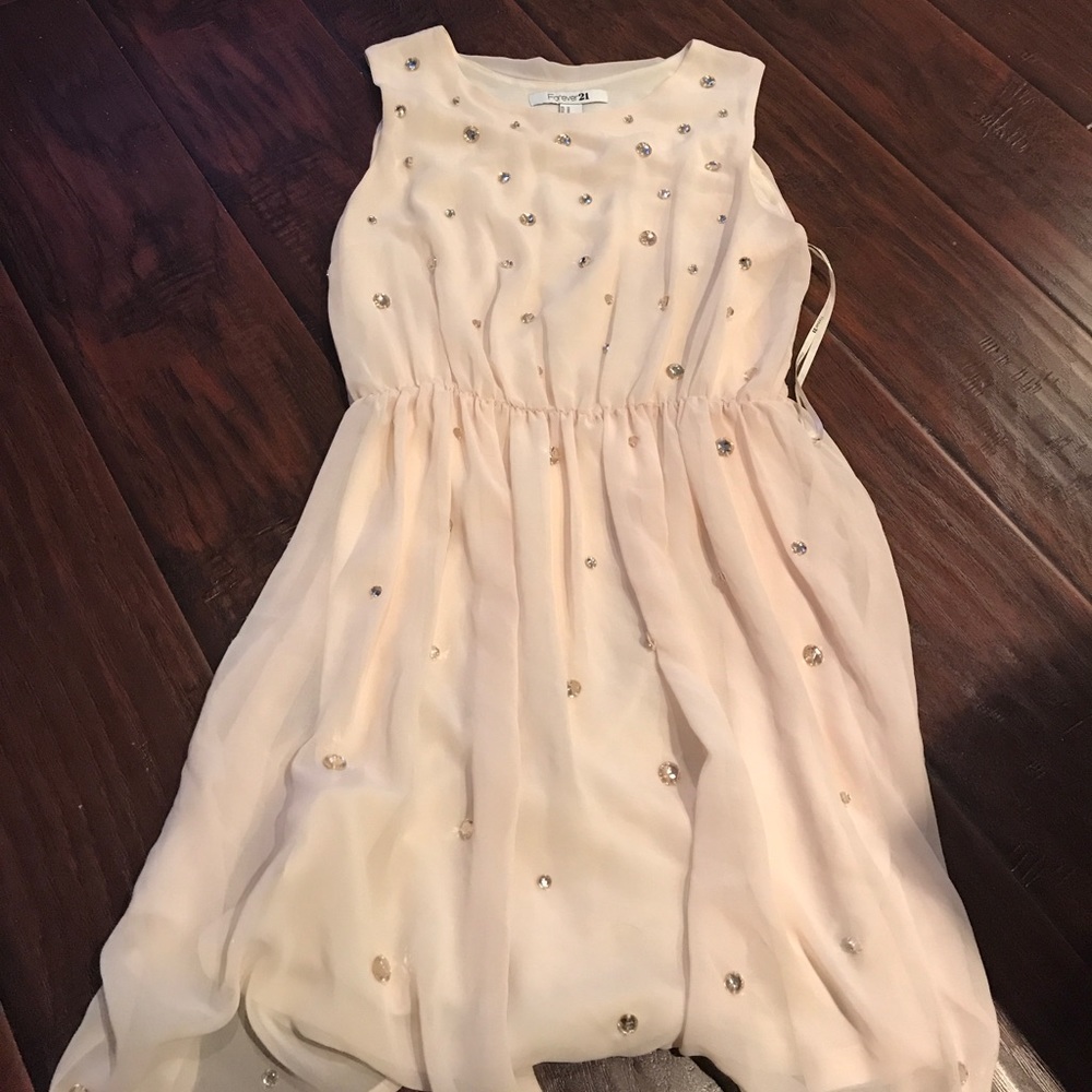 Elegant nude dress with large rhinestone details