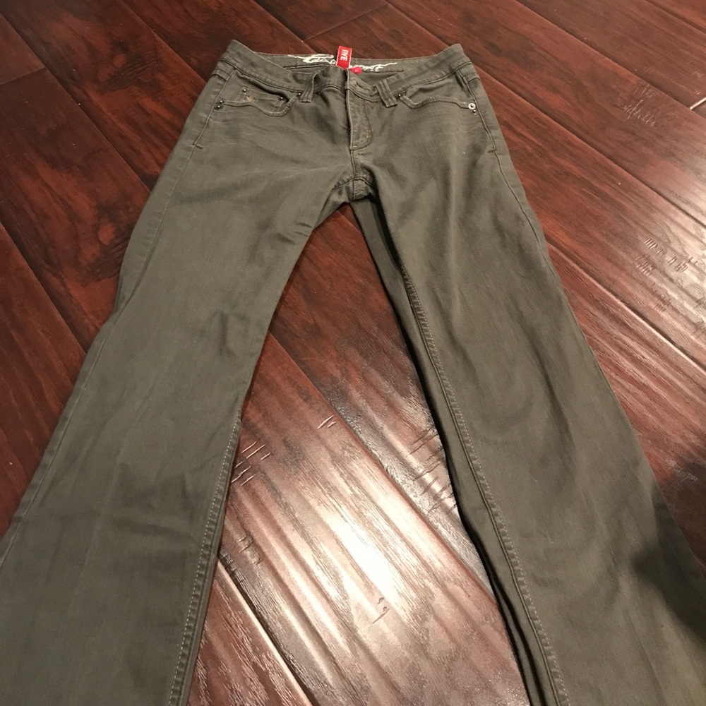 Slightly distressed olive green jeans