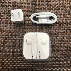 iPhone charger, earbuds, and stickers