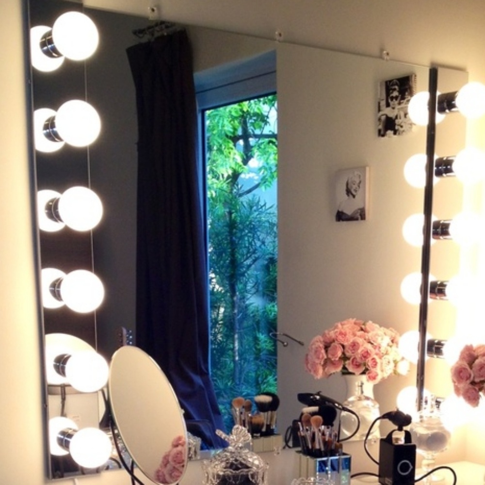 Chrome plated wall lamp for vanity.