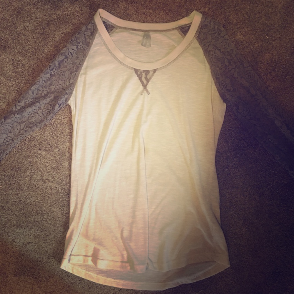 A cream long sleeved shirt with lace sleeves