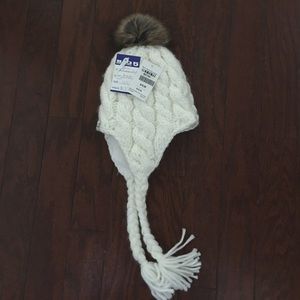 White beanie with a dark brown fur ball on top.