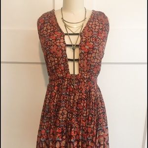 Free People deep neckline open back mini dress