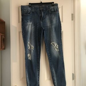 Seven jeans with sequin distressed look.