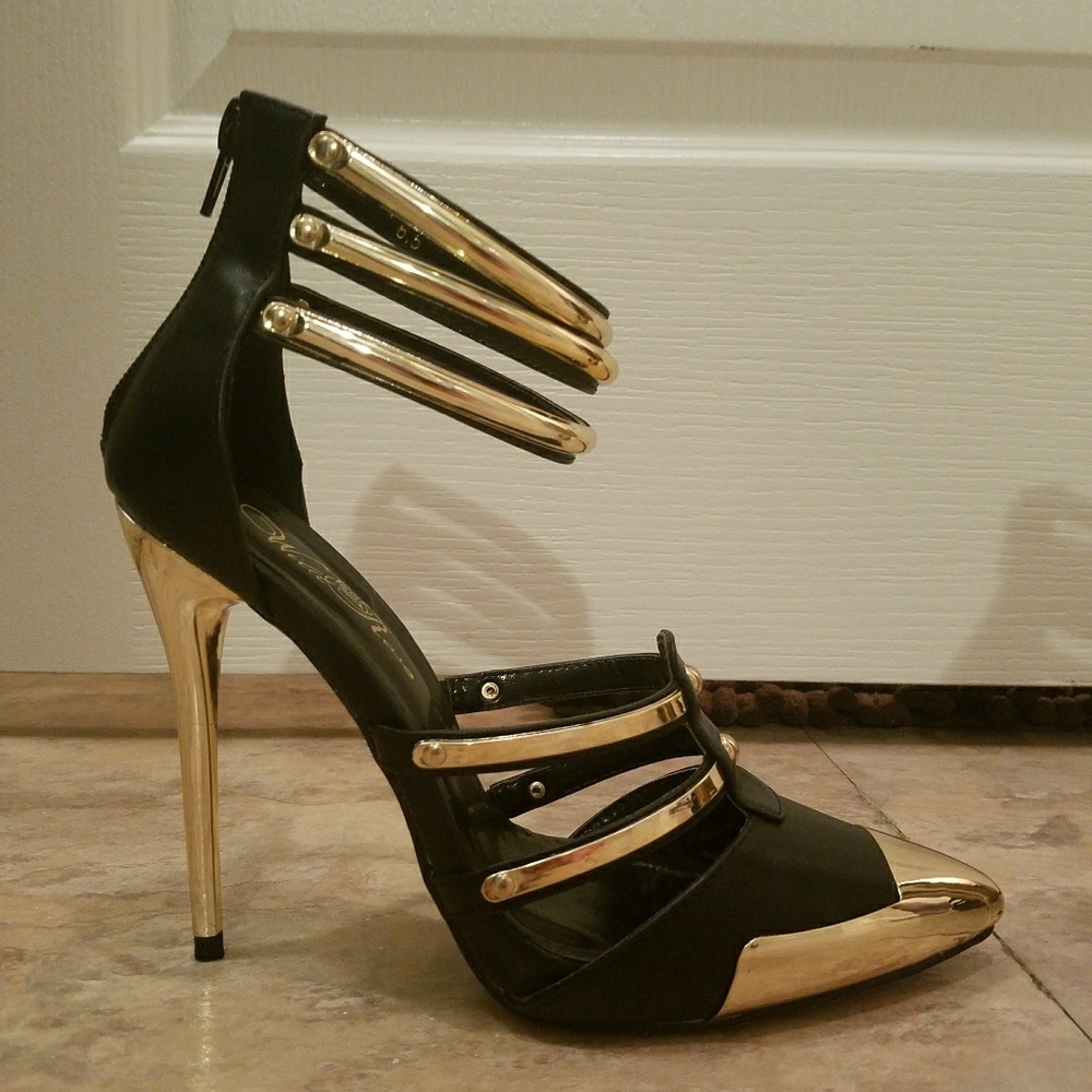 Beautiful black heels with gold accents.
