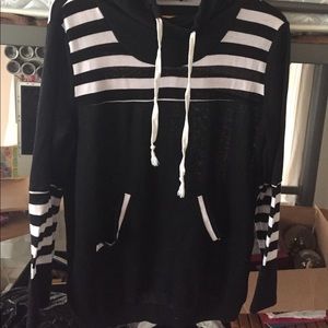 Long sleeve, black and white stripped sweater.