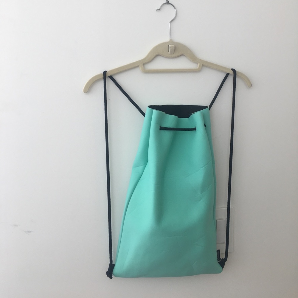 Triangl swimsuit top, bottom, and bag in aqua
