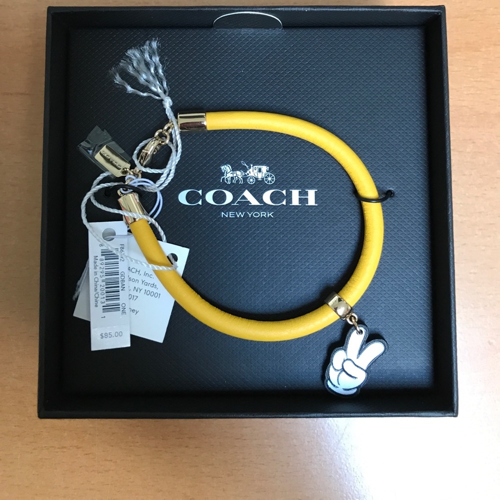 Coach Disney bracelet.  Yellow with Mickey hand.