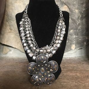 Silver multi strand necklace with flower pendant