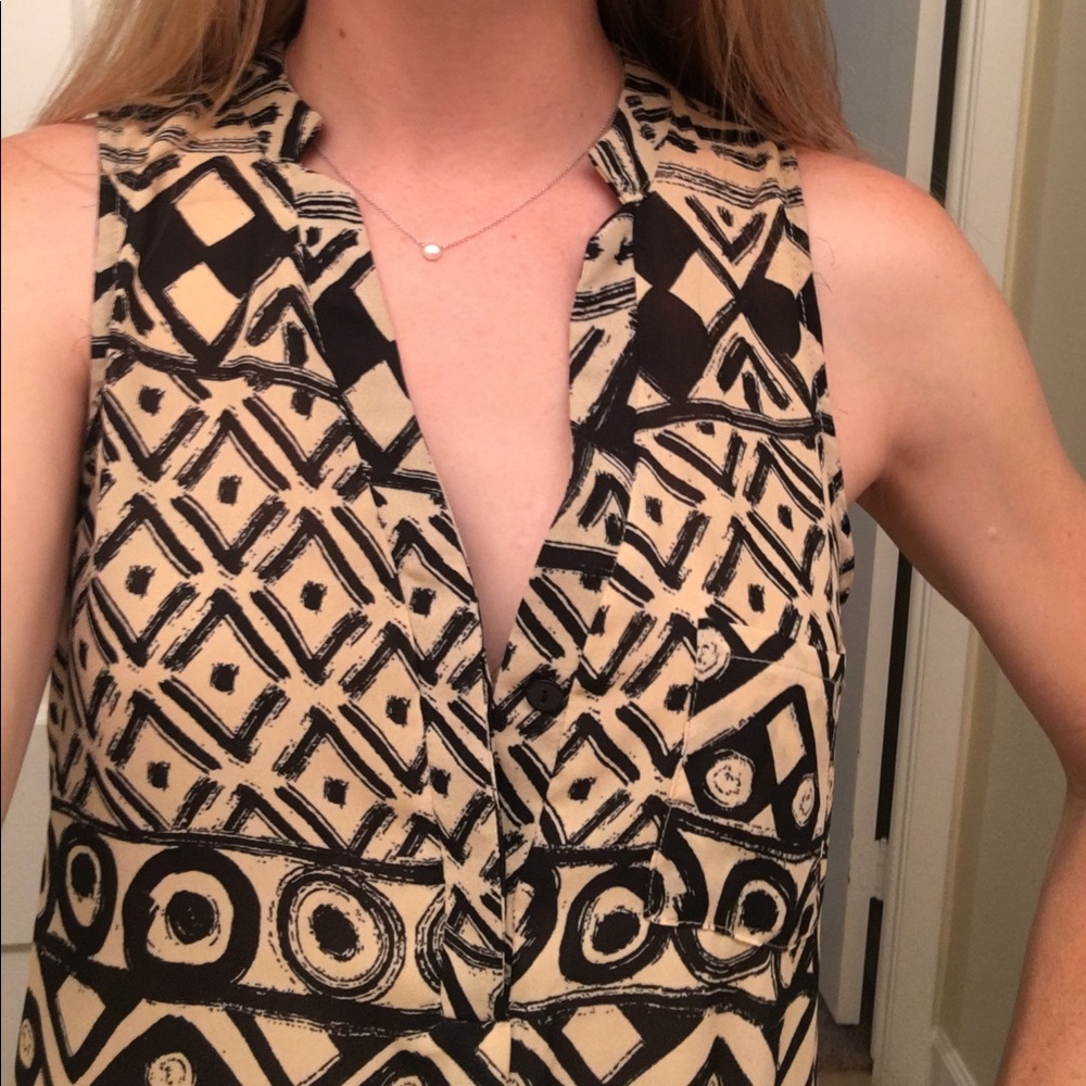Flattering patterned sleeveless blouse