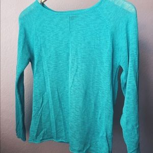 teal colored mid sleeve shirt