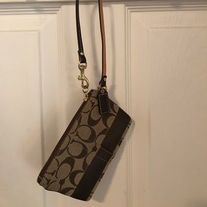 Brown coach wristlet.