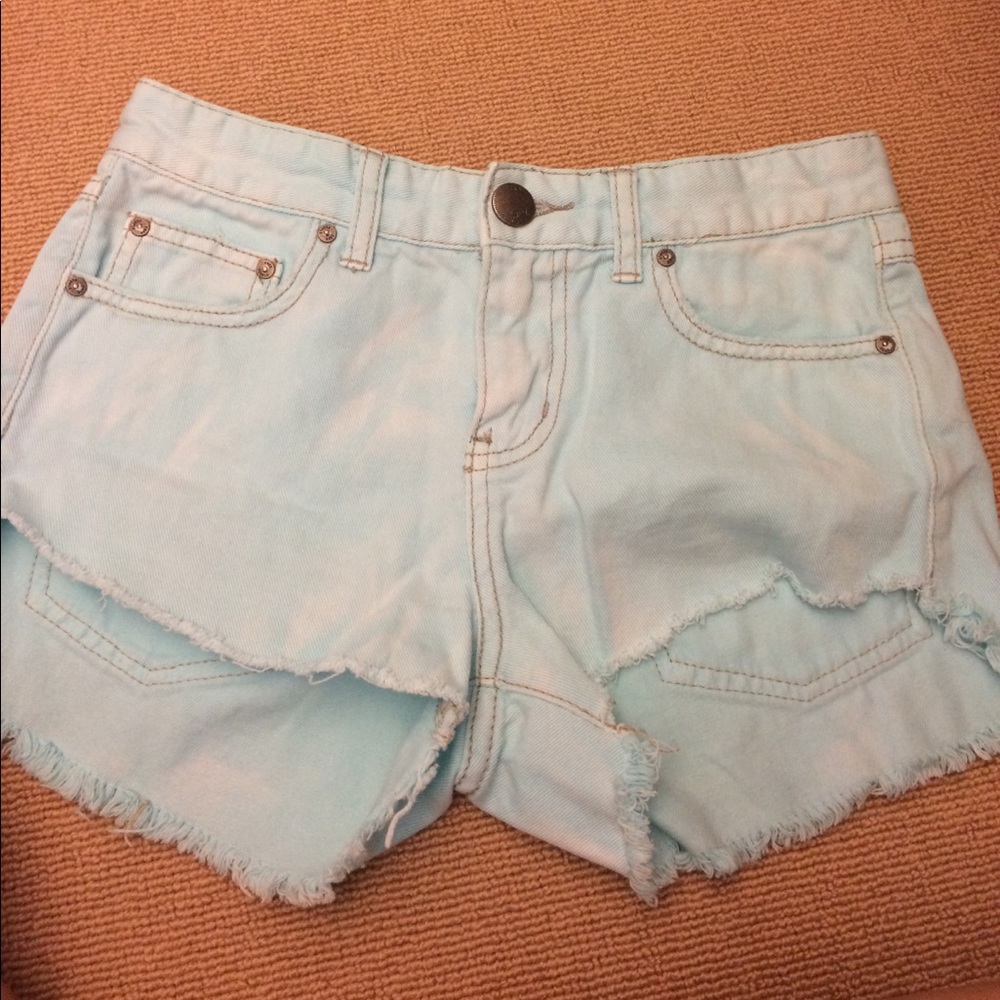 Free people high waisted distressed blue shorts