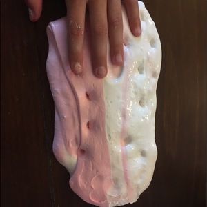 Unicorn poop slime. Comes with container