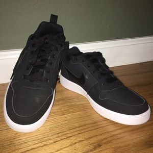 Black suede Nike sneakers