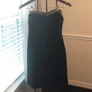 Black bodycon strapless dress with gold spikes