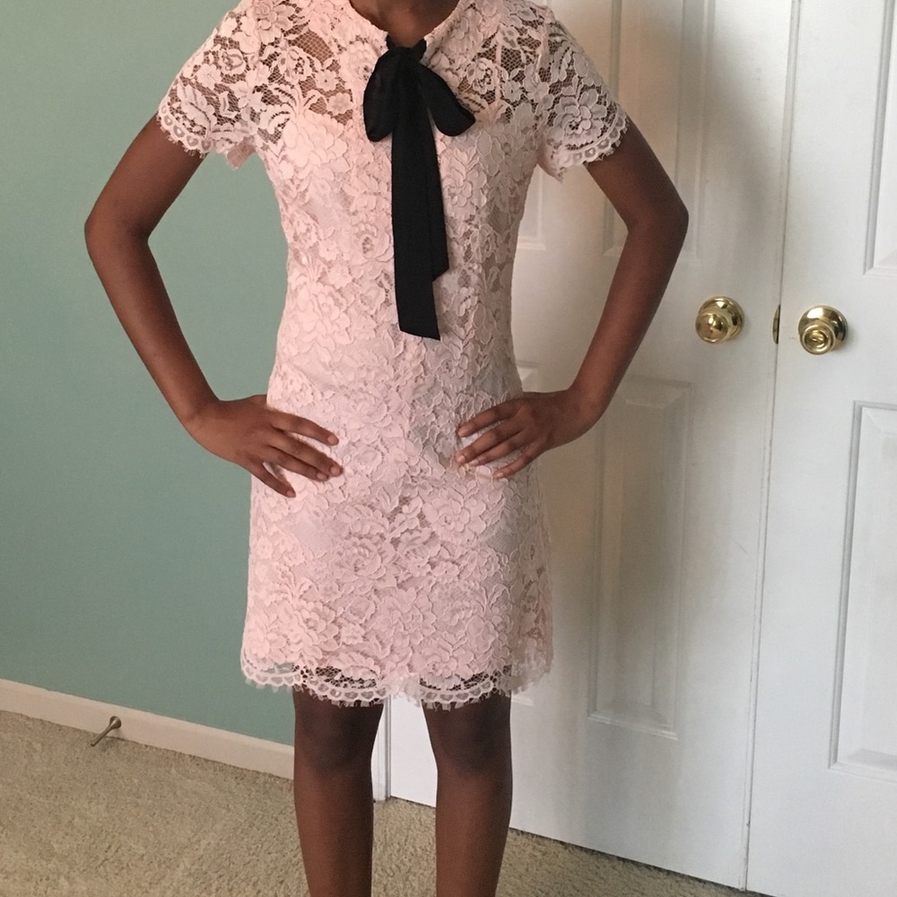 Lace dress with neck tie.