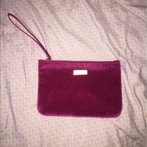 Pink faux fur makeup bag. Gold interior.