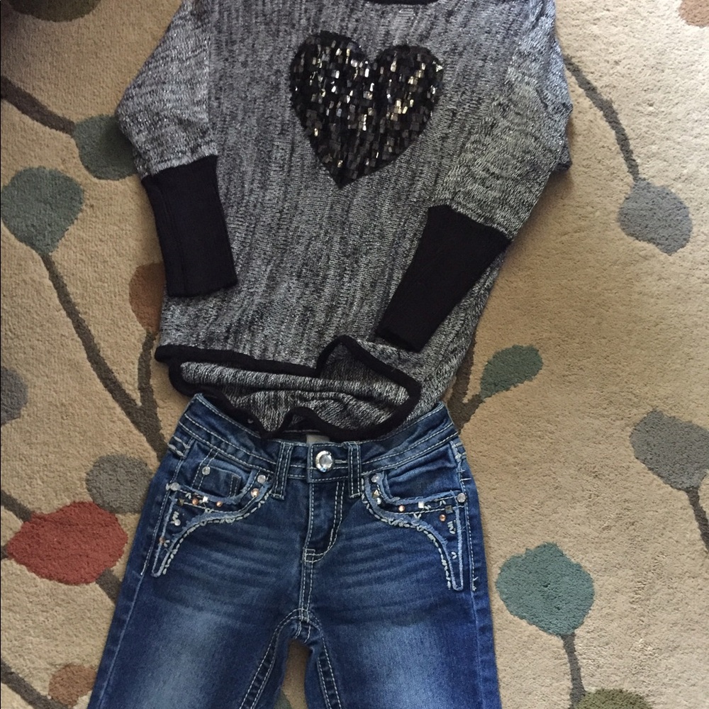 Girls justice jeans and girls sweater.