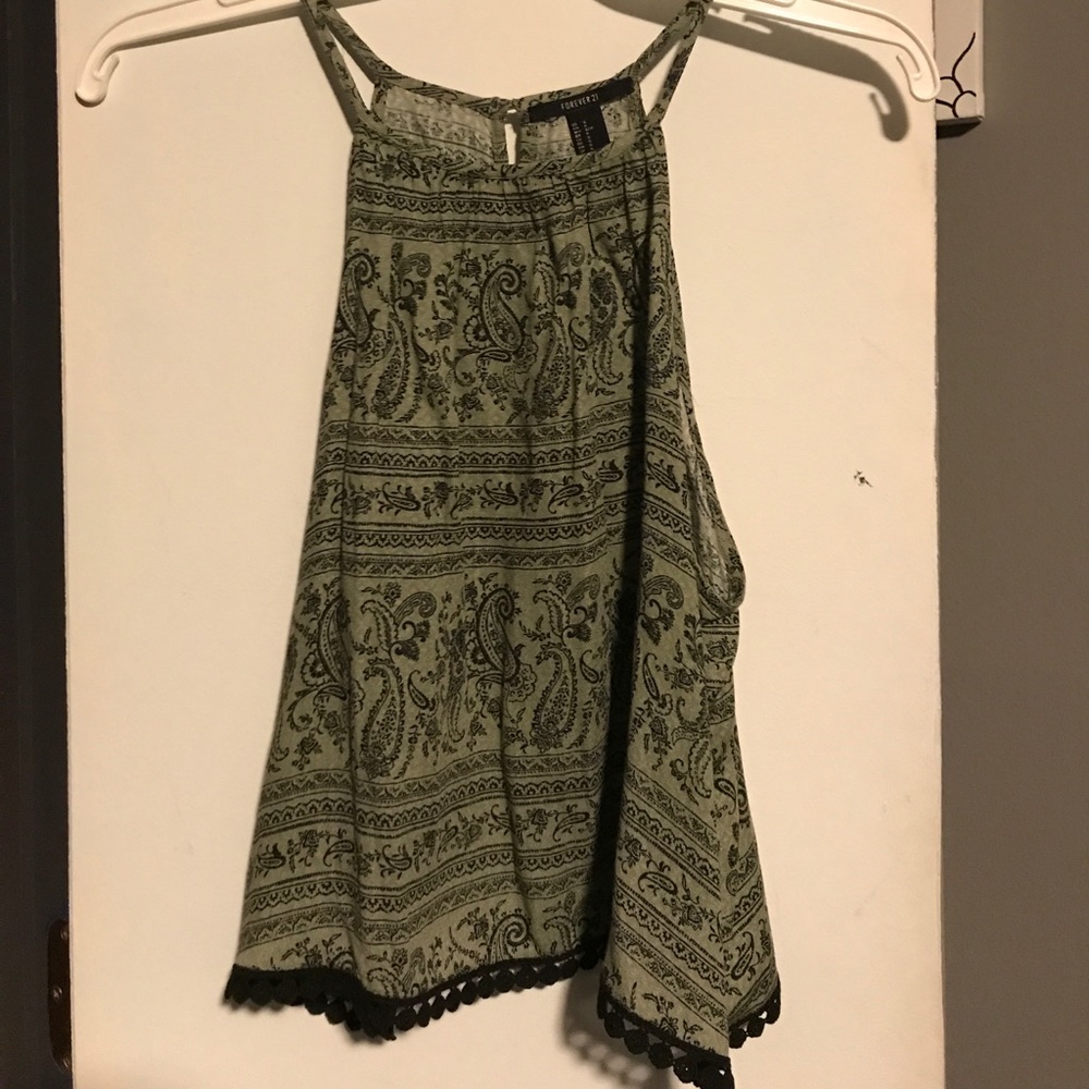 Green and black blouse with pom poms