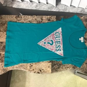 A Guess T-shirt with embellishment on the front