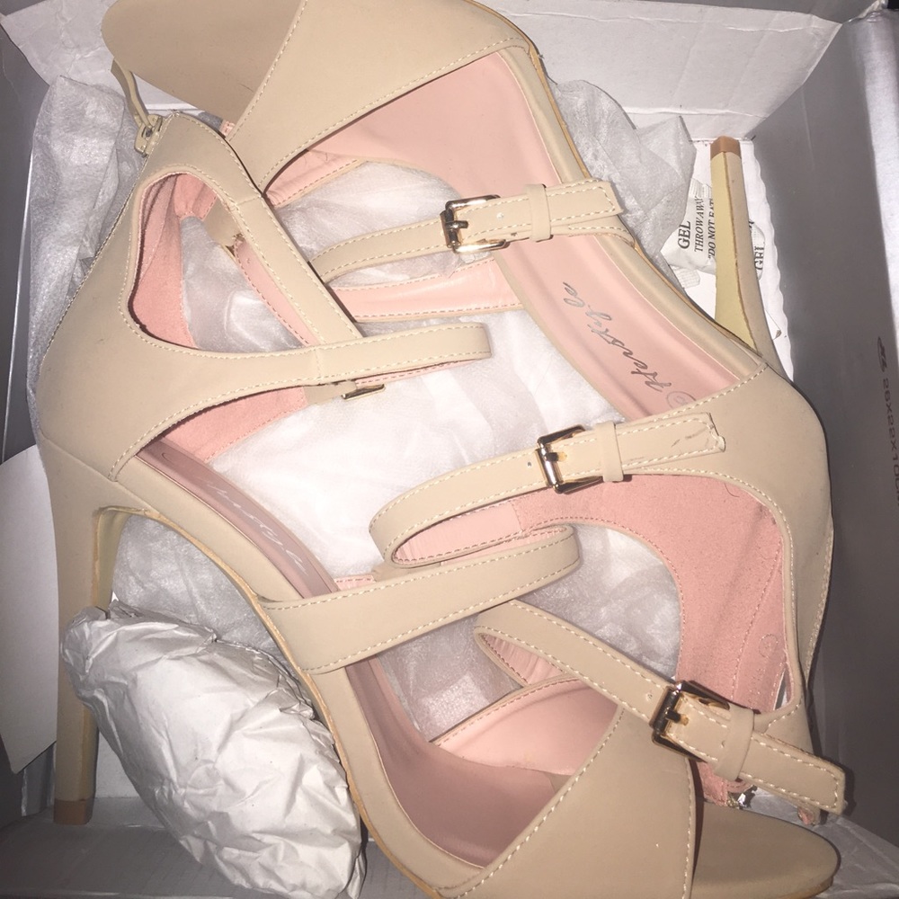 Woman's beige lace heels.