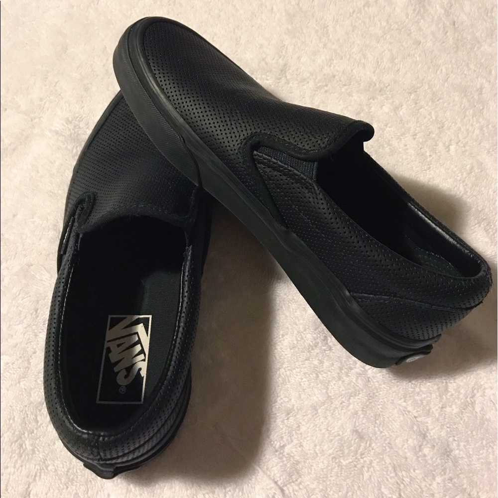 All black leather slip on Vans