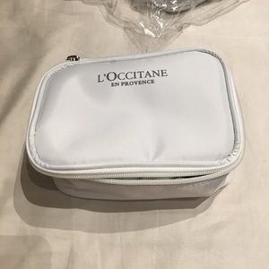 L'occitane lip balm, lotion, toiletry travel bag.