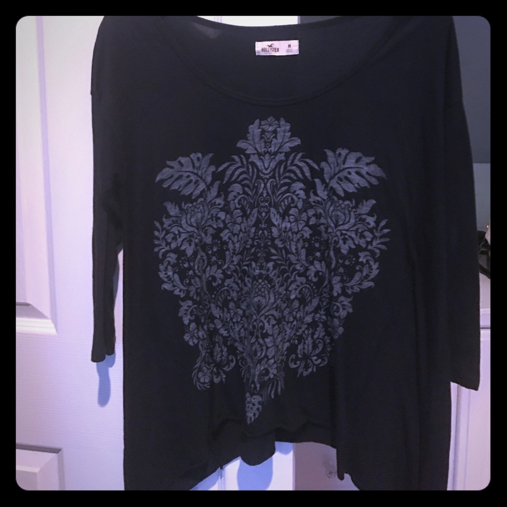 3/4 length asymmetrical shirt.