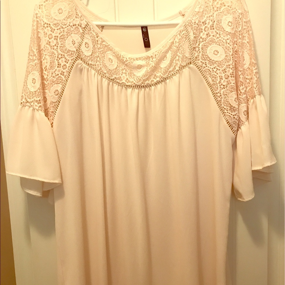 Size large, ivory blouse. Never been worn.
