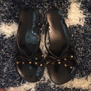 Black bow tie sandals with gold hardware