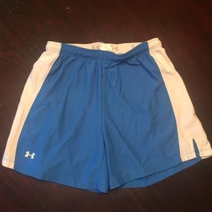 blue and white UA shorts.