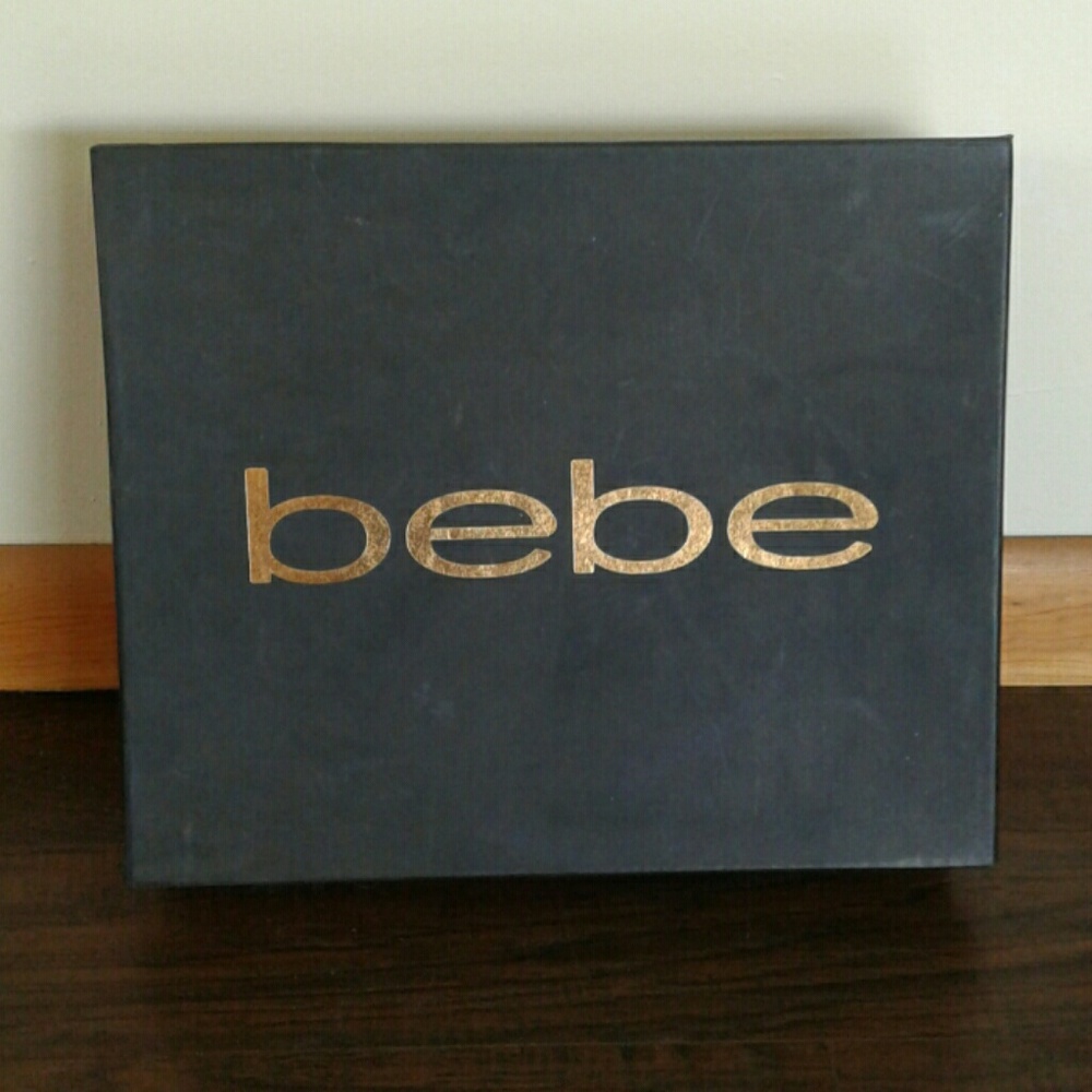 BEBE.   swade and leather thigh high boots.