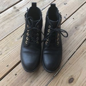 Black ankle boots with gold accent