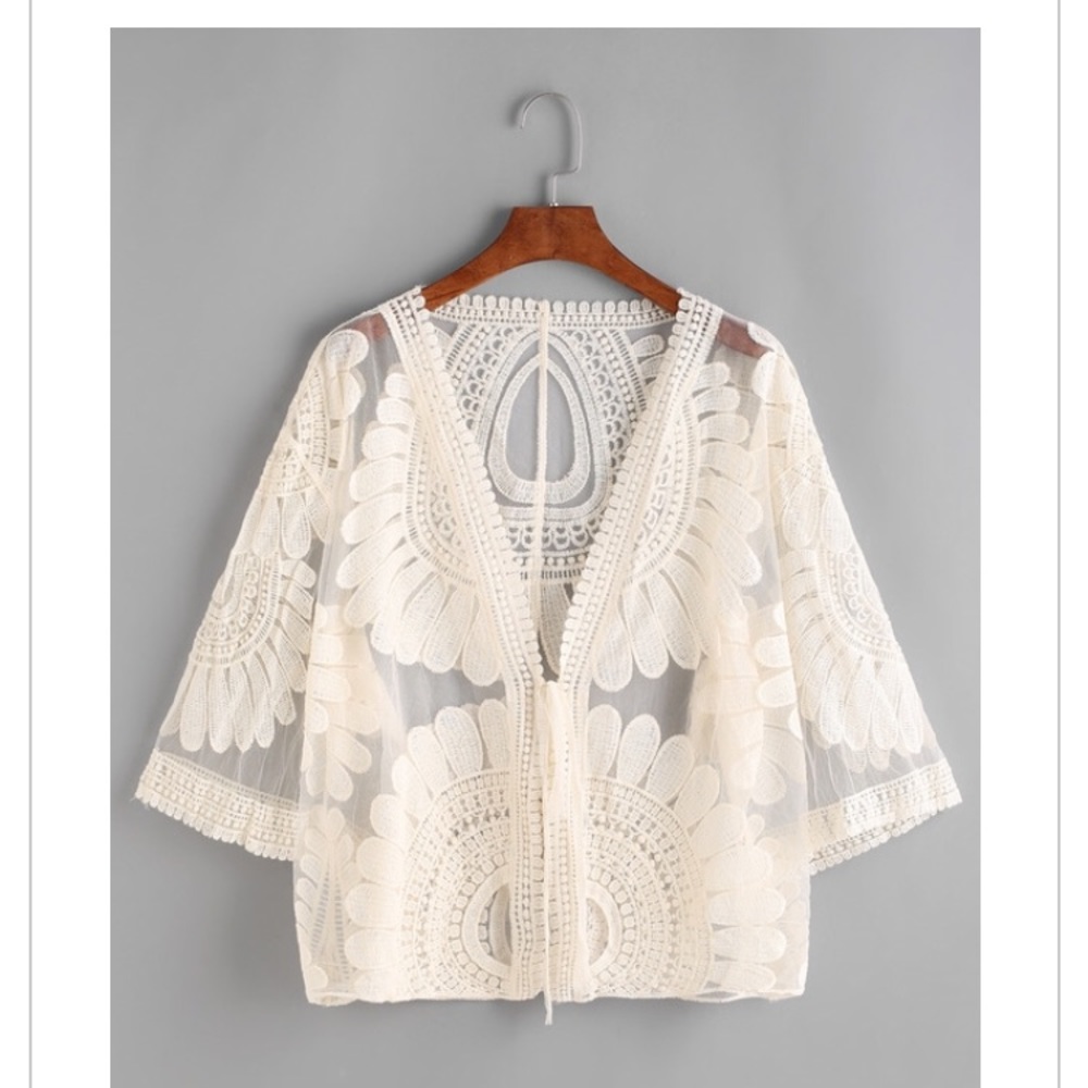 Beach cover up. Embroidered and see thru