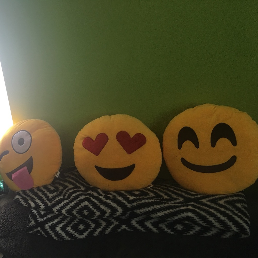 three emoji pillows