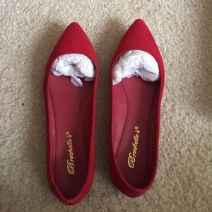 Red pointed toed flats
