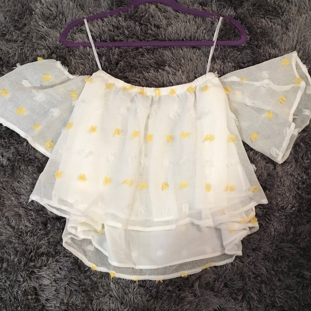 Detailed off the shoulder top with tassels