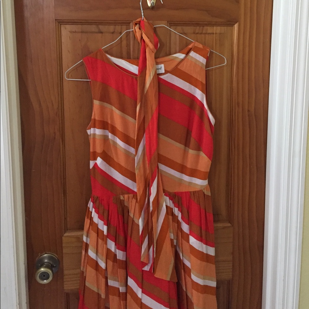 A knee length, sleeveless dress.