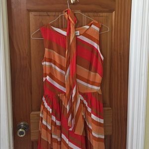 A knee length, sleeveless dress.