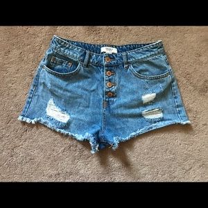 jean shorts with distressed areas