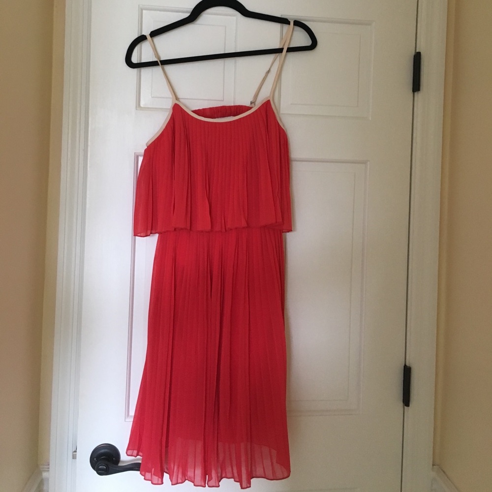 Red pleated dress with cream detailing