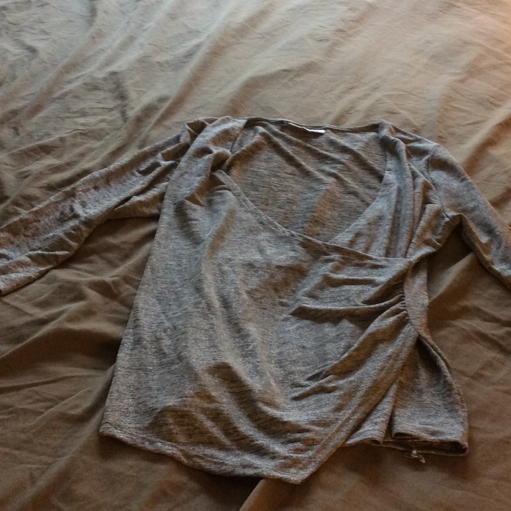 Super flattering, shimmery, faux wrap top