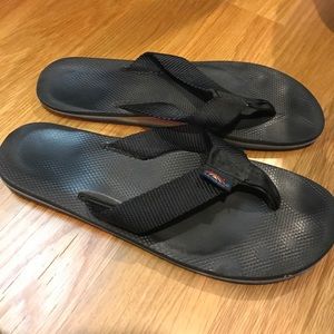 Worn rainbow flip flops