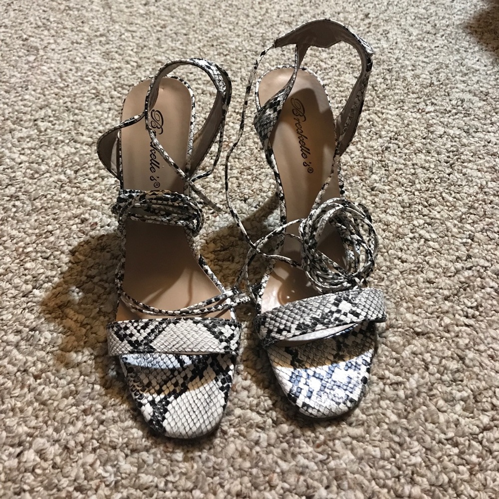 Black and white snake skin strappy heels.