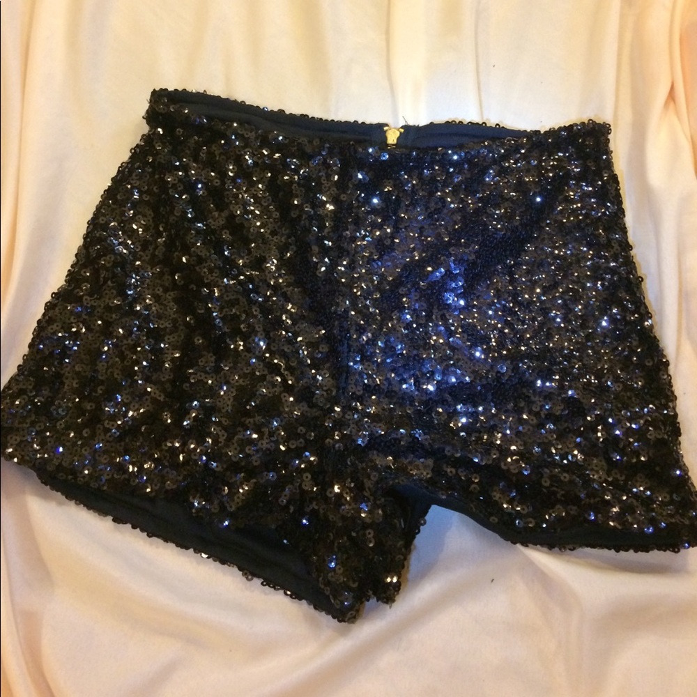 Black sequined shorts.