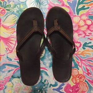 Brown rainbow flip flops