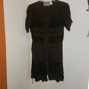 Brown dress with embroidery.