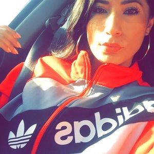 Red adidas zip up jacket.
