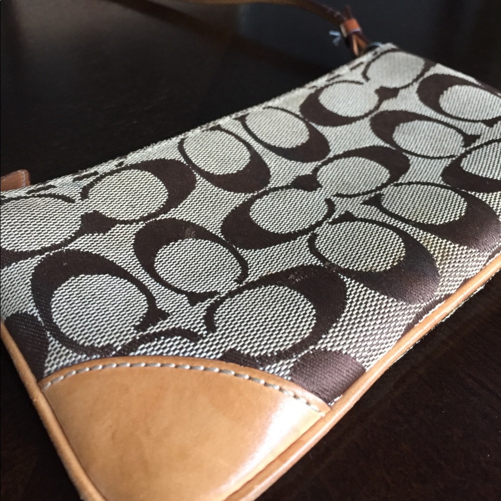 Tan Coach cross body clutch